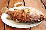 Fried Fish On Wood Table Stock Photo