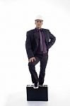 Full Body Pose Of Architect With One Leg On Briefcase Stock Photo