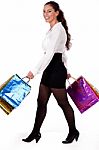 Full Length Shot Of Young Woman Holding Shopping Bag Stock Photo