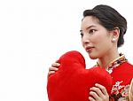 Girl in Chinese Dress Holding Heart Stock Photo