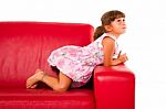 Girl On Red Sofa Stock Photo