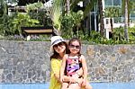 Girl With Her Mother Outside Swimming Pool Enjoying The Summerwi Stock Photo