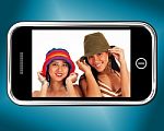 Girls Wearing Hats On Mobile Stock Photo