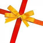 Gold Bow On Red Ribbon Stock Photo