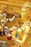 Golden Statue Of Kinara Sawasdee At Wat Phra Kaew In Grand Place Complex In Bangkok, Thailand Stock Photo