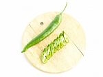 Green Chili Pepper Sliced With Raw Material On Cutting Board Stock Photo