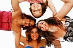 Group Of Happy Women Standing In Huddle, Smiling, Low Ange View Stock Photo