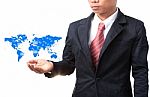 Hand Of Business Man And Blue World Map Stock Photo