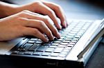 Hand Typing On Laptop Keyboard Stock Photo