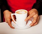 Hands Of Waiter Serving A Cup Of Cappucino Stock Photo