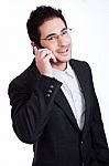Handsome Young Business Man Talking Over Phone Stock Photo