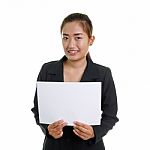Happy Businesswoman Holding A White Banner Stock Photo