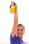 Happy Fitness Woman Lifting Kettlebell Stock Photo