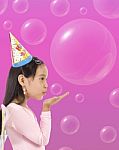 Happy Girl Blowing Bubbles Stock Photo