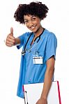 Happy Lady Doctor Showing Thumbs Up Sign Stock Photo