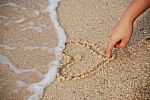 Heart Drawing On The Sand Stock Photo