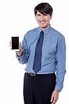 Isolated Black Businessman Showing His Cell Phone Stock Photo