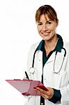 Isolated Lady Doctor Writing Prescription Stock Photo