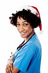 Lady Doctor With Santa Cap Stock Photo