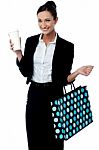 Lady Holding Coffee Cup And Shopping Bag Stock Photo