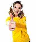Lady Listening Music With Thumbs Up Stock Photo