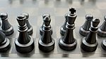 Light And Dark Wooden Chess Pieces On Chess Table Stock Photo