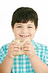 Little Boy Eating Bread Stock Photo