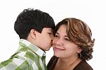 Little Boy Kiss His Mother Stock Photo