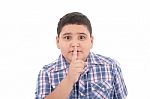 Little Boy With Silence Gesture Stock Photo