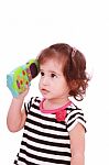Little Girl With Toy Phone Stock Photo