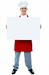 Male Chef Holding Blank Board Stock Photo