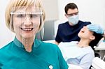 Male Dentist With Patient, In Clinic Stock Photo