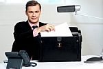Male Executive Keeping Documents Safely Stock Photo