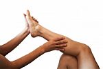 Male Hands Massaging Female Foot Stock Photo