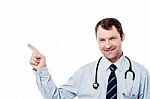 Male Physician Pointing At Something Stock Photo