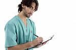 Male Surgeon Writing Prescription Stock Photo