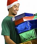 Man Carrying Lots Of Presents