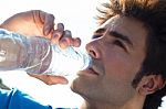 Man Drinking Water After Sport Activities Stock Photo