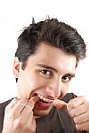 Man Flossing His Teeth Stock Photo