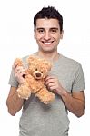 Man Holding Teddy Bear Stock Photo
