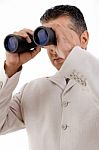 Man Looking Through Binocular Stock Photo