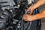 Mechanic Repairing Engine Stock Photo