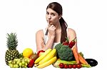 Mischievous Look Of A Young Woman With Fruits Stock Photo