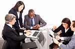 Multi Ethnic Team During Meeting Stock Photo