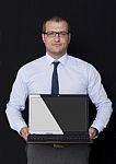 Office Worker Holding A Laptop Stock Photo