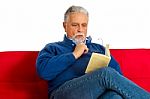 Old Man Reading Book Stock Photo