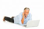 Old Man With Mobile And Laptop Stock Photo