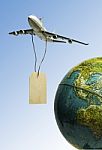 One Airplane Hanging With Black Wooden Price Tag Over The Earth Stock Photo
