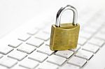Padlock On White Keyboard Network Security Conception Stock Photo
