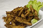 Pork Fried Thai Style In Green Salad Dressing Stock Photo